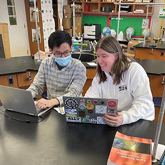 Gloria mentoring a fellow teacher